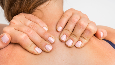 Self-massage with CBD topicals and oils for neck, shoulders, hands and feet as a relaxing self-care ritual