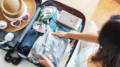 Traveler packing CBD BioCare hemp CBD products for a stress-free trip